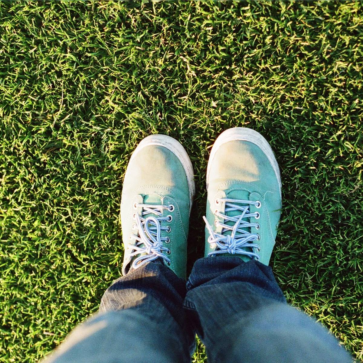 A happy customer stands on their lawn Greenwood Lawn Care Bend Oregon